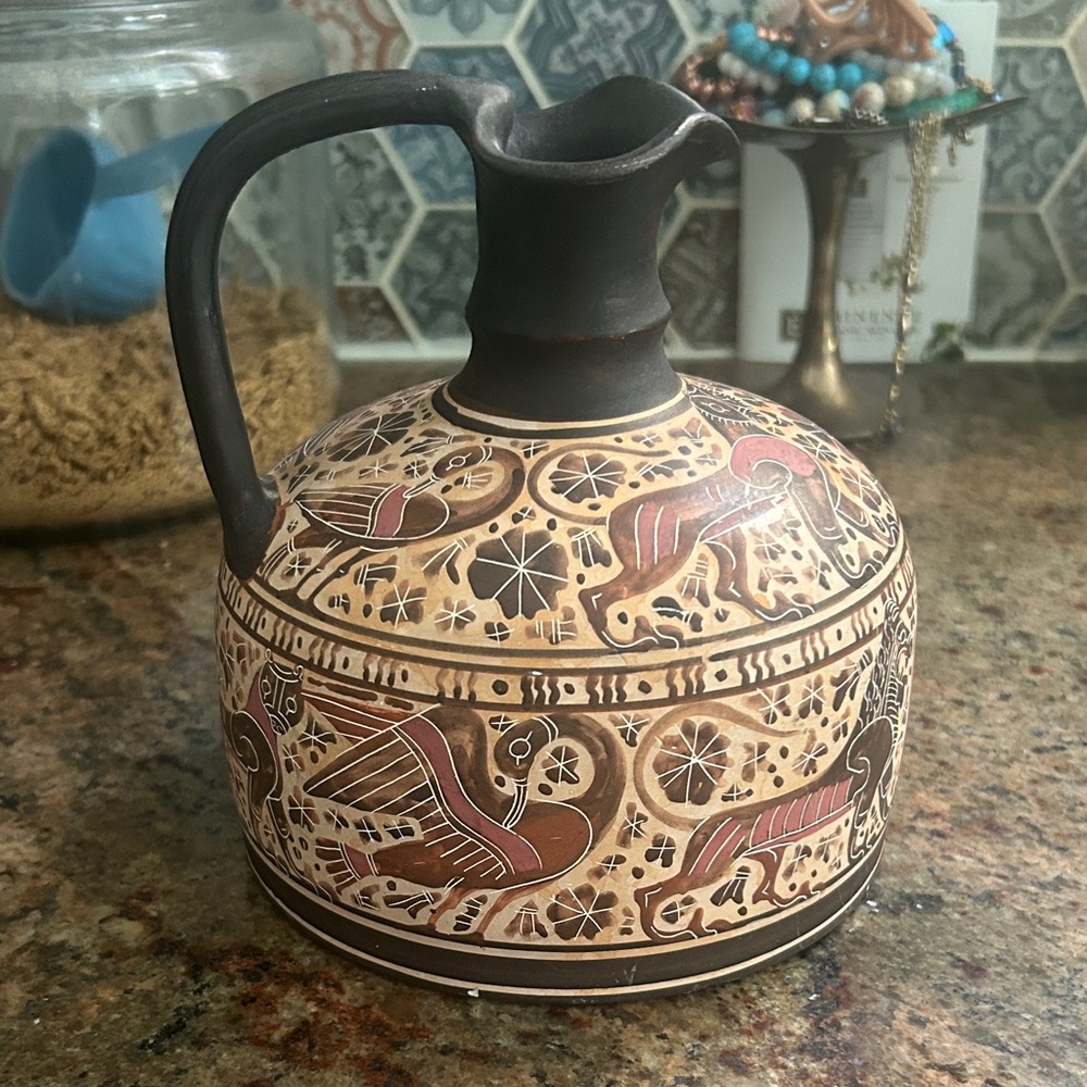 Handcrafted Ceramic Pitcher with Intricate Design